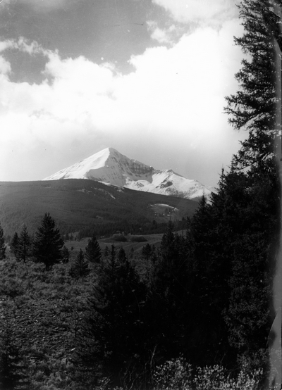A snow covered mountain (looks like Lone Mountain, Montana)