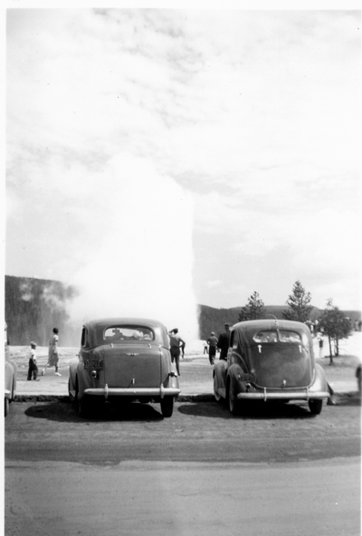 Yellowstone Park - tourists view a geyser spout
