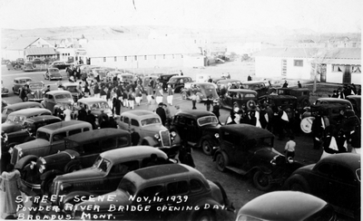 Street scene, November 11, 1939, Powder River Bridge opening day, Broadus, Montana