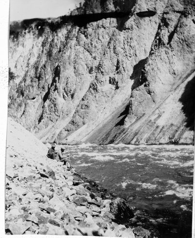 Fishermen aside a river