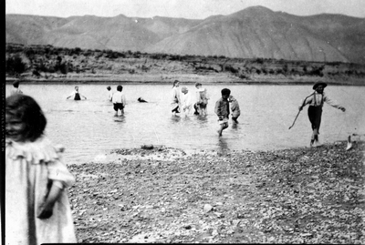 Children wading in the Marias River