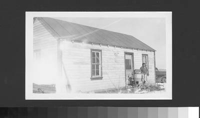 Early 20th Century Arapaho Woman Standing On a Front Porch