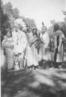 Bernadotte: Blackfeet Indians: White Man and Woman Dressed in Indian Garb Pose with Three Indians, 1939