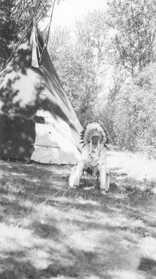 Bernadotte: Blackfeet Indians: Man in Full Indian Dress in Front of Tipi, 1939