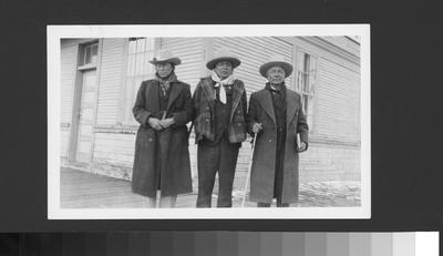 Black and white photo of Eddie Big Beaver, Irvine Mad Plume and Yellow Kidney posing for a photo.
