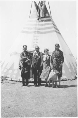 Black and White photo of a group of people including Bird Rattle and Cecile Last Star, Browning, Montana, 1935