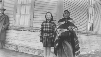Black and white photo of Yellow Kidney, Mrs. Yellow Kidney and James Willard Schultz