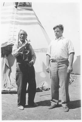 Black and white photo of Yellow Kidney with another man in front of a tipi