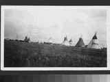 Black and white photo of many tipis, Waterton Lake, Alberta, 1927