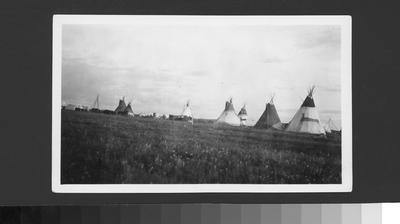 Black and white photo of many tipis, Waterton Lake, Alberta, 1927