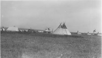 Black and white photo of a tipi and tent camp, Belly River, Alberta, 1927