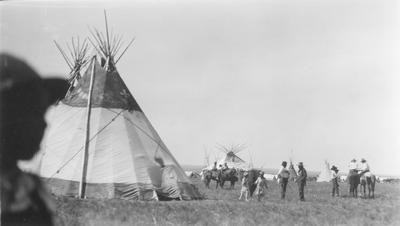 Black and white photo of Horn Society and Matokiks Lodges, Belly River, Alberta, 1927