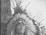 Photo of Eli Guardipee wearing a head dress