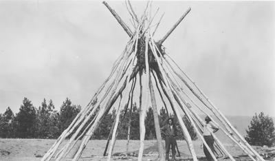 Two Men by a Kutenai Sun Lodge