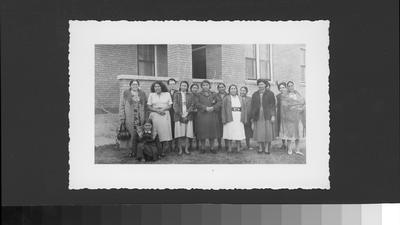 A large group of women standing outside a brick building, North Plains Crafts Assn Annual Meeting