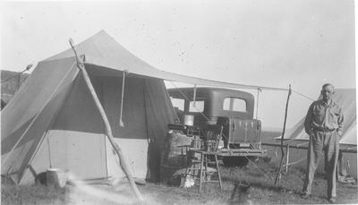 Camp prints: James Willard Schultz Standing by a Wall Tent