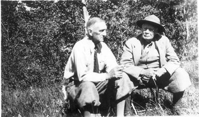 James Willard Schultz with General Hugh Scott Smoking Outside on a Lawn, 1915