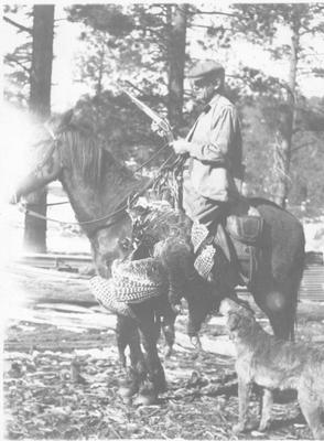 Man Riding a Horse While Turkey Hunting with His Dog