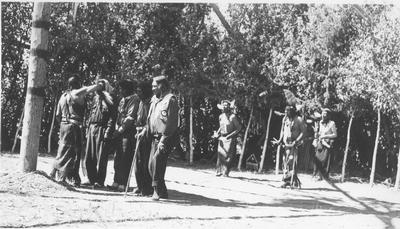Photo of eight men, including Torrey Roberts, Pitsua Taylor, Steve Tappay, Hugo Brotsu and Ben Piney, arranged in three rows during a ceremony.