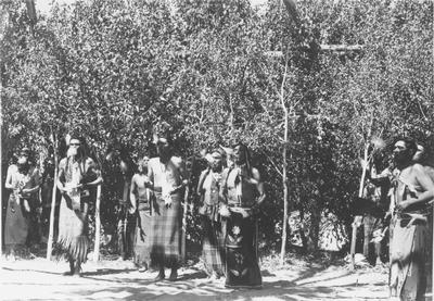 Photo of a group of men including, Frank Pogue, John LeClair, Andrew McAdams, Logan Brown, John Brown, Harry Bonatsie, in ceremonial dress