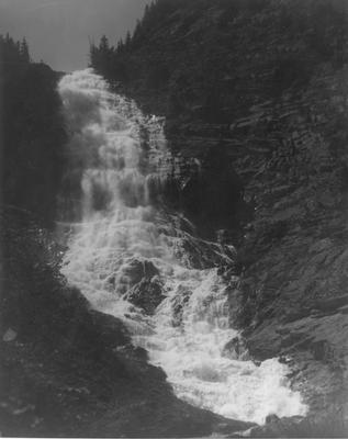 Waterton Lakes National Park: Bertha Falls Running Over Rocks on a High Cliff